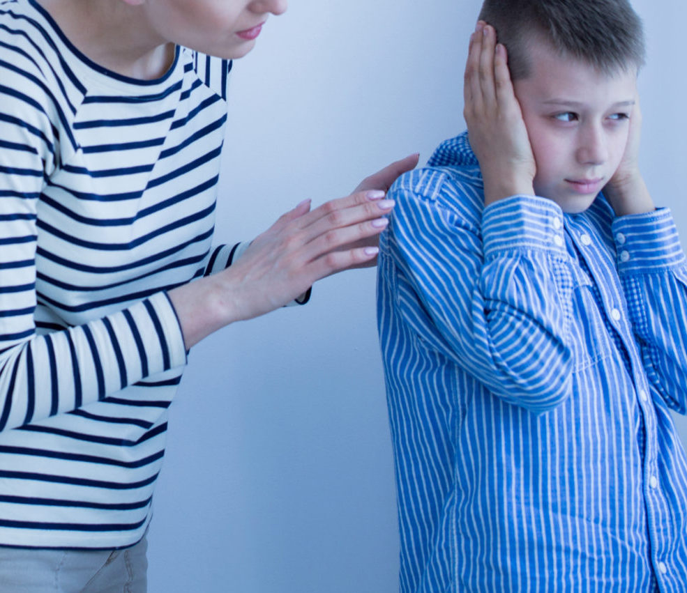 Autistic boy covering his ears during a therapeutic session_Misophonia_Research_Fund